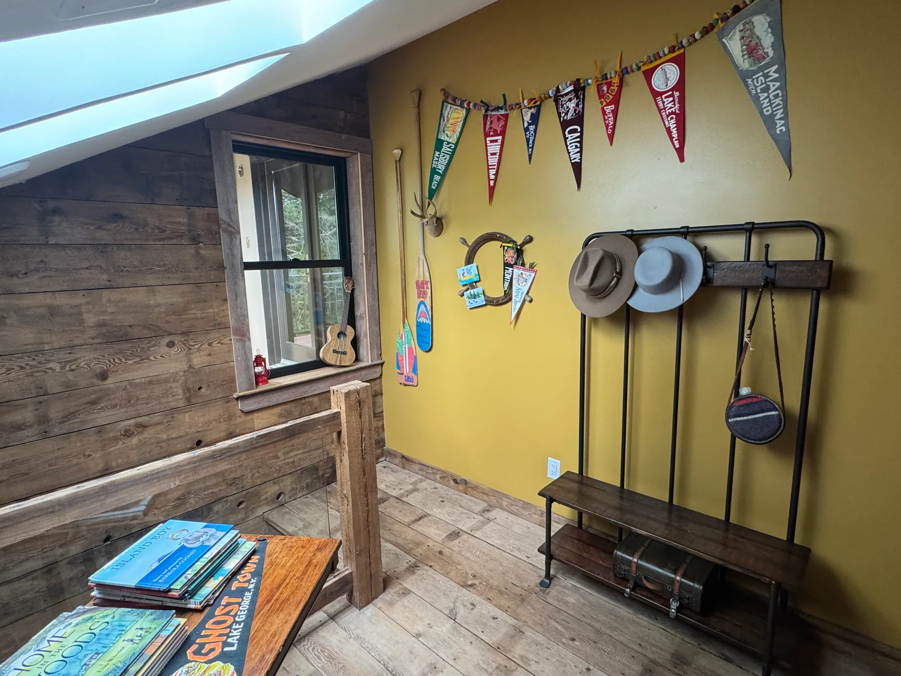Picture books arranged in the rustic upper bunk room at Grey Cloud Island